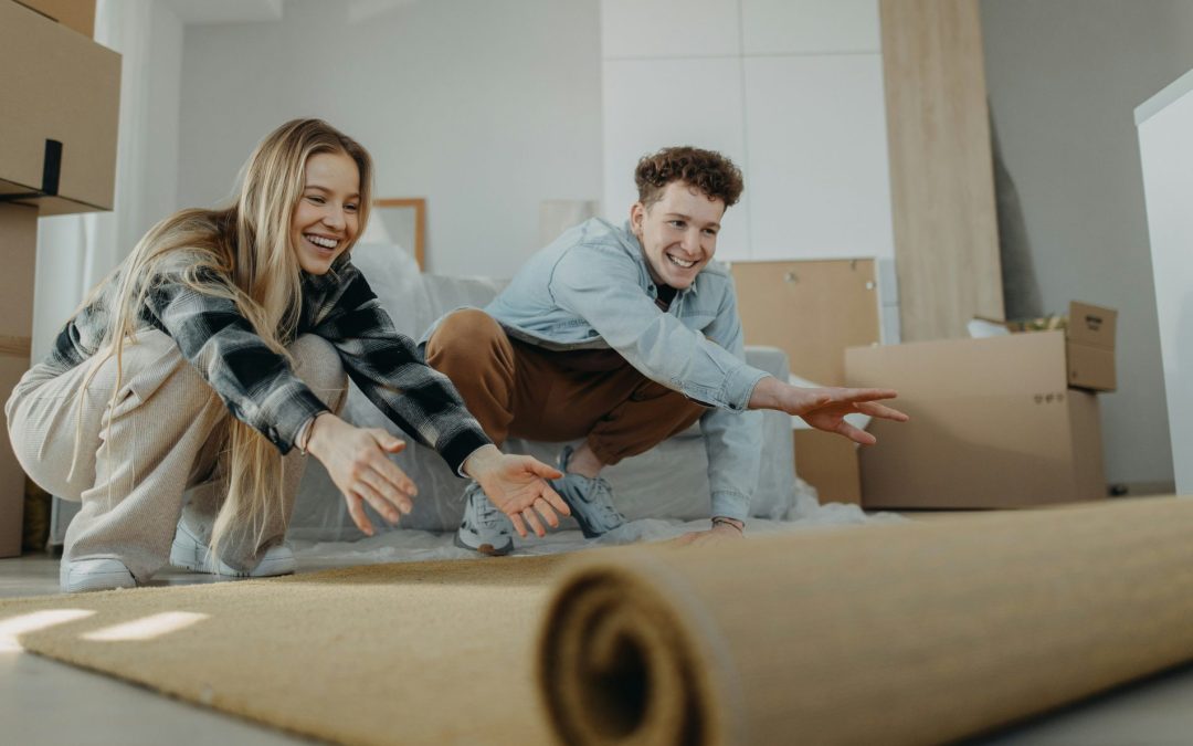 Couple rolling out carpet